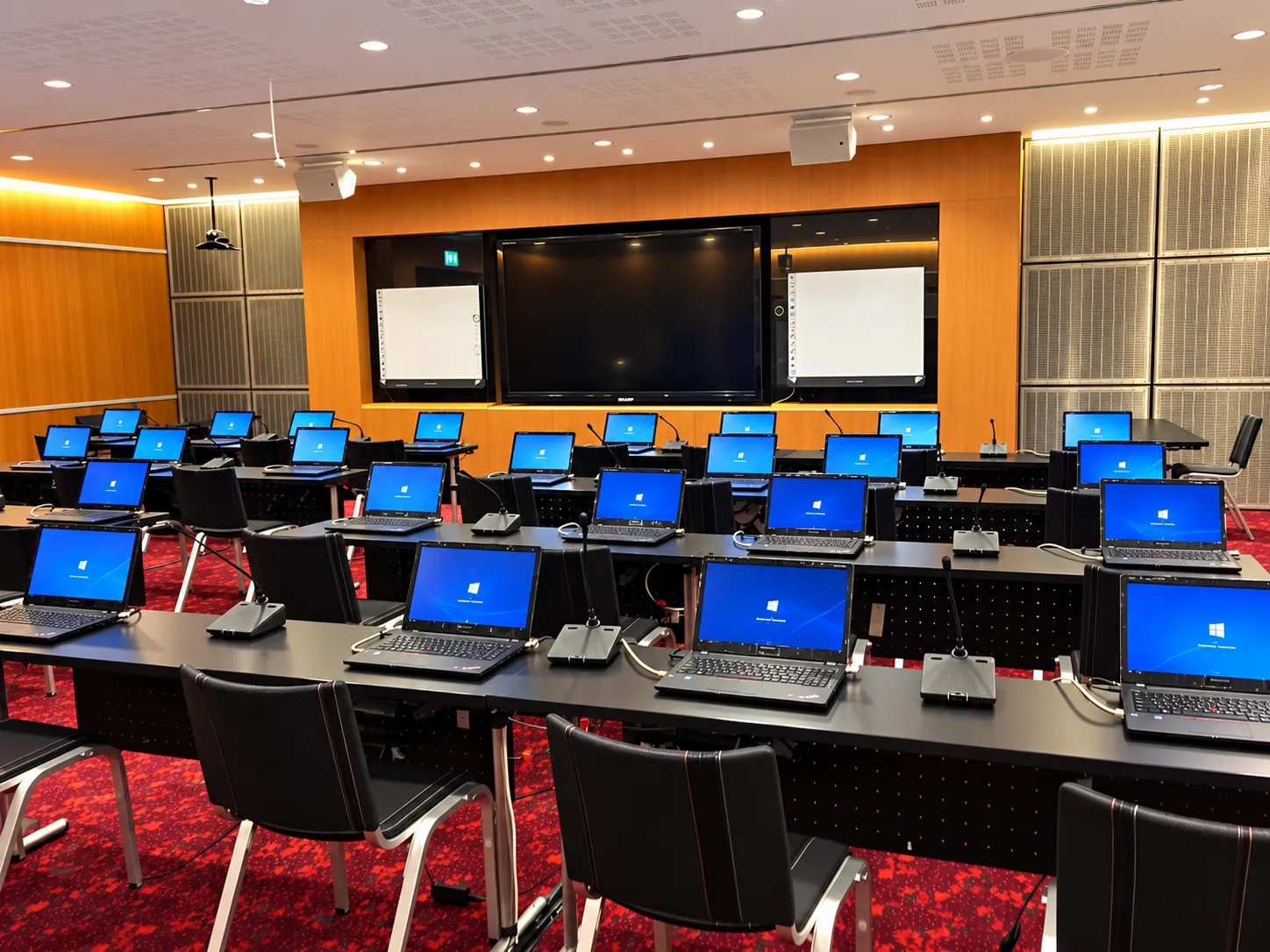 Conference classroom prepared with laptops