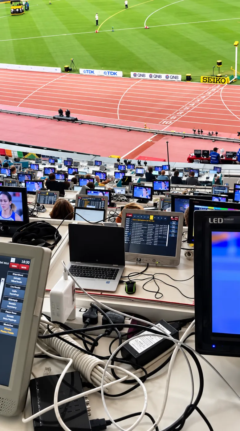 Press row IT equipment setup at a stadium event